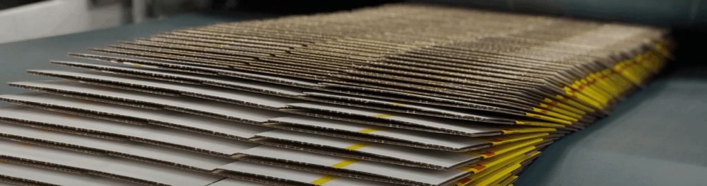 Boxes shingled on a machine